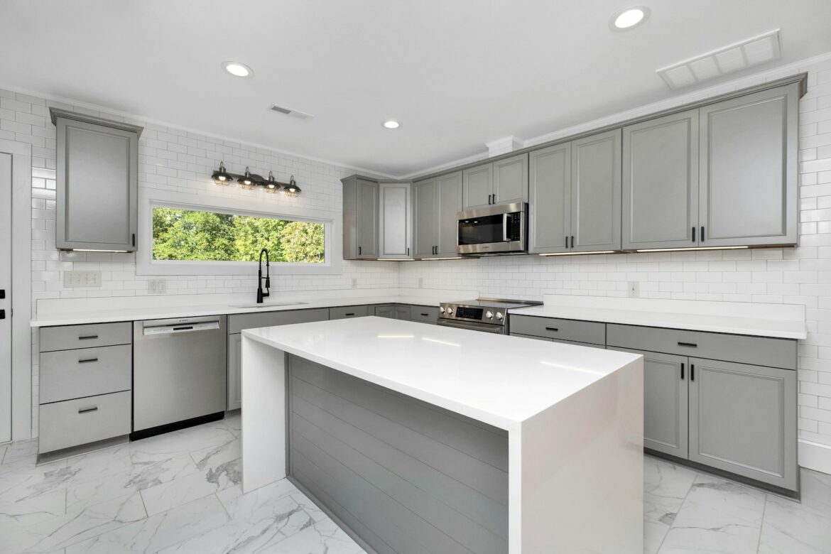a kitchen with white cabinets